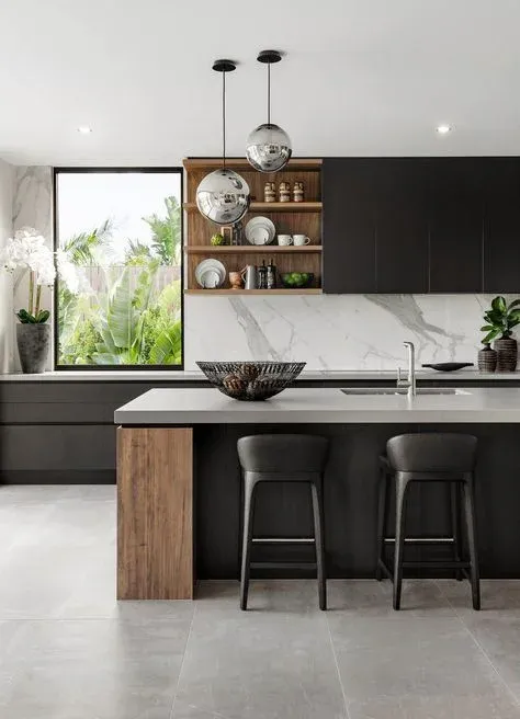 Elegant modern kitchen with white cabinetry and marble countertops